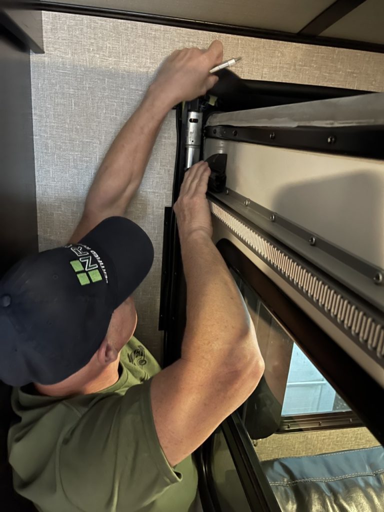 Clay Buckley repairing the interior of an RV